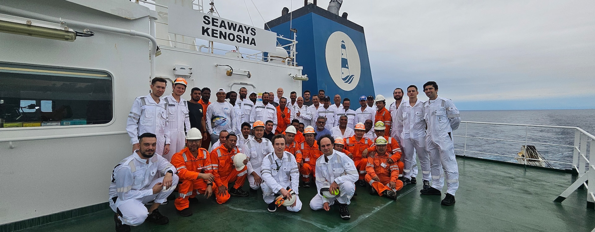 The crews of the Seaways Kenosha and La Pena pose for a photo on the Seaways Kenosha