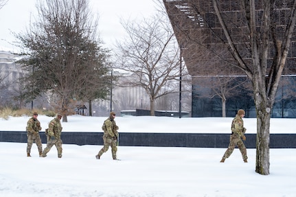 Service members assigned to the National Guard move throughout Washington, D.C. to assist residents during a winter storm, Jan. 25, 2026, in support of the D.C. Safe and Beautiful mission. Snow and icy conditions impacted travel across the District, prompting National Guard personnel to provide assistance to people in need while maintaining a visible presence in affected neighborhoods. As part of the D.C. Safe and Beautiful mission, approximately 2,500 National Guard members support local and federal partners to help maintain public safety and community resilience throughout the nation’s capital. (U.S. Air National Guard photo by Master Sgt. William Blankenship)