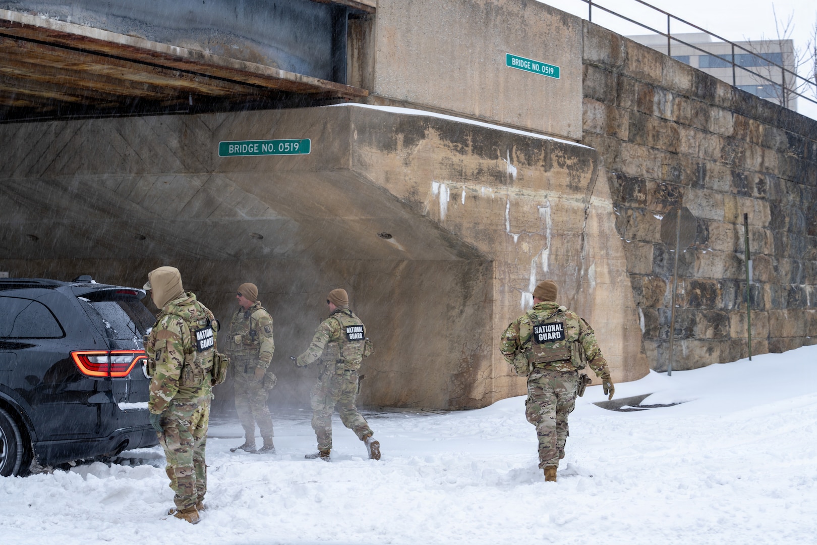 Service members assigned to the National Guard move throughout Washington, D.C. to assist residents during a winter storm, Jan. 25, 2026, in support of the D.C. Safe and Beautiful mission. Snow and icy conditions impacted travel across the District, prompting National Guard personnel to provide assistance to people in need while maintaining a visible presence in affected neighborhoods. As part of the D.C. Safe and Beautiful mission, approximately 2,500 National Guard members support local and federal partners to help maintain public safety and community resilience throughout the nation’s capital. (U.S. Air National Guard photo by Master Sgt. William Blankenship)