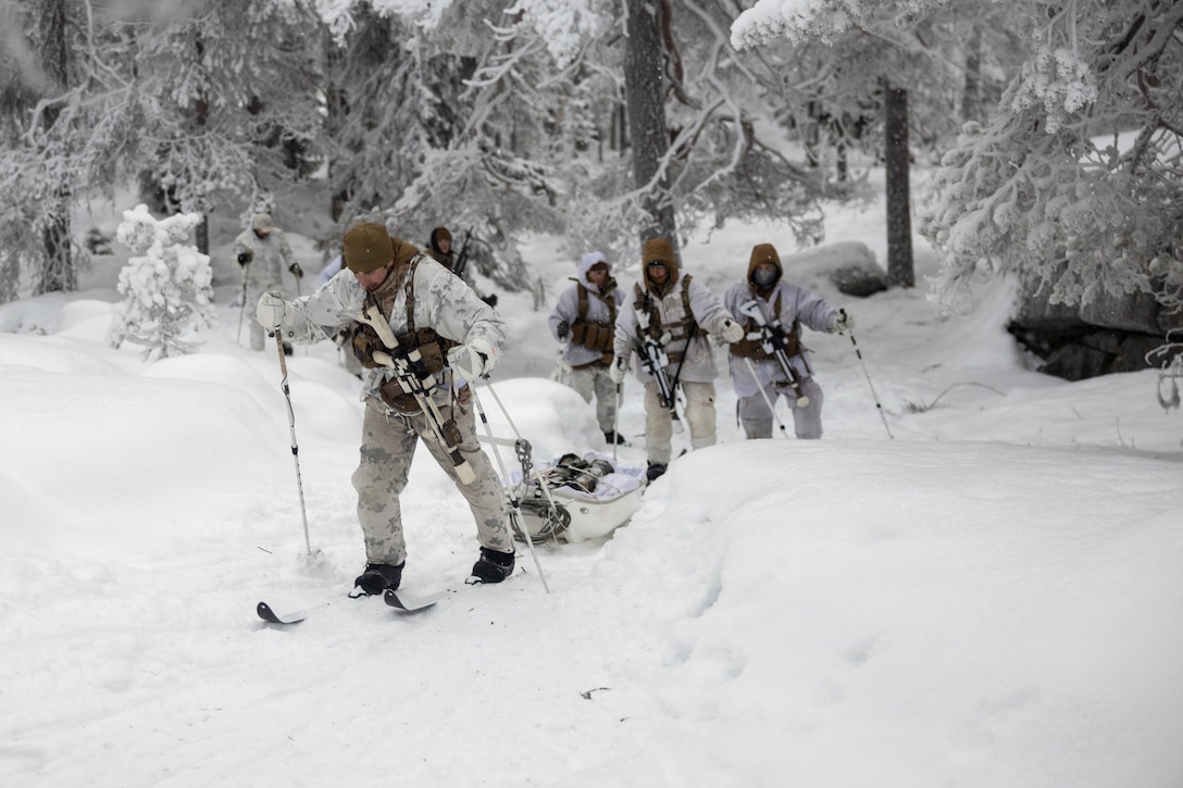 A U.S. Navy special operations independent duty corpsman with 2nd Reconnaissance Battalion, 2nd Marine Division, pulls a pulk sled in Kalix, Sweden, Jan. 13, 2026. The purpose of the Winter Warfare Course is to train ground forces in a variety of cold-weather subjects, including skiing, how to use pulk sleds, develop winter fighting positions, camouflage and concealment, and several other areas that are vital in order to survive and operate in a cold-weather environment. It was also conducted in preparation for exercise Cold Response 26. (U.S. Marine Corps photo by Lance Cpl. Hunter J. Kuester)