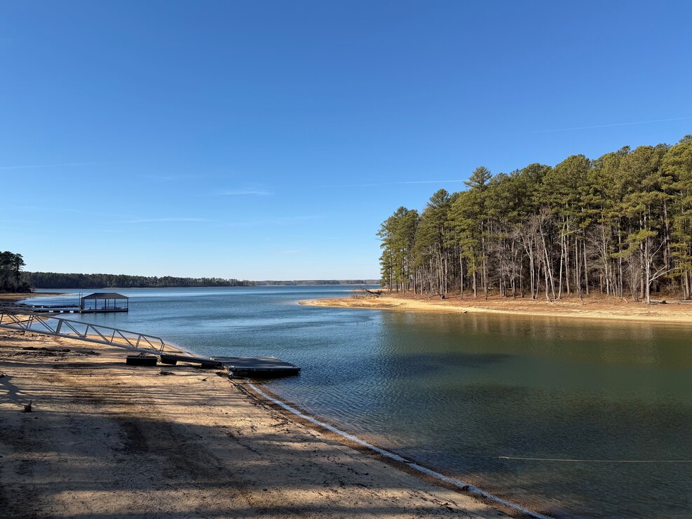 Picture of a cove at Kerr Reservoir taken in January 2026 featuring permitted docks and several geese.