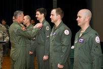 Gen Steve Nordhaus presents the Distinguished Flying Cross to Maj. Benjamin “Boom” Saunders, Maj. Eric “Fume” Anderson & Capt. Ryan “Hammer” Boodee of the D.C. National Guard's 113th Wing.