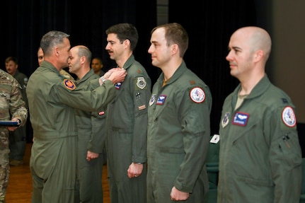 Gen Steve Nordhaus presents the Distinguished Flying Cross to Maj. Benjamin “Boom” Saunders, Maj. Eric “Fume” Anderson & Capt. Ryan “Hammer” Boodee of the D.C. National Guard's 113th Wing.
