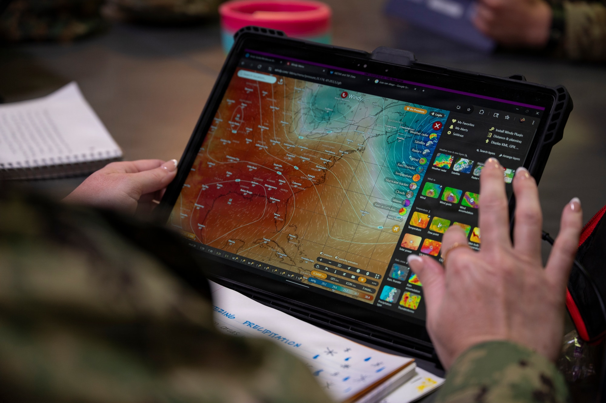 A white board with drawings is displayed.