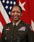 U.S. Army Maj. Gen. Antoinette Gant, Commanding General of Joint Task Force-National Capital Region and U.S. Army Military District of Washington, posing for an official portrait wearing Army green service uniform in front of the U.S. Flag and the red 2-star general flag.