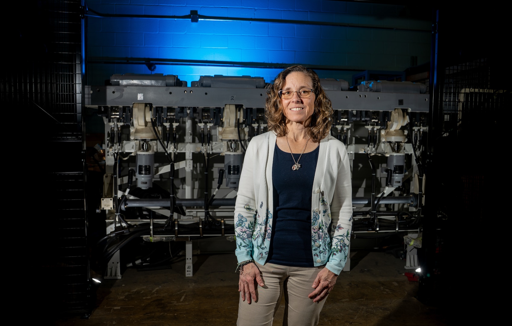 DAHLGREN, Va. — Karen Wingeart, division head for the Maritime Warfare Control Systems Division at Naval Surface Warfare Center Dahlgren Division, stands in a high bay facility used for combat systems testing. Wingeart leads efforts that support the development, integration and readiness of U.S. Navy warfighting capabilities.