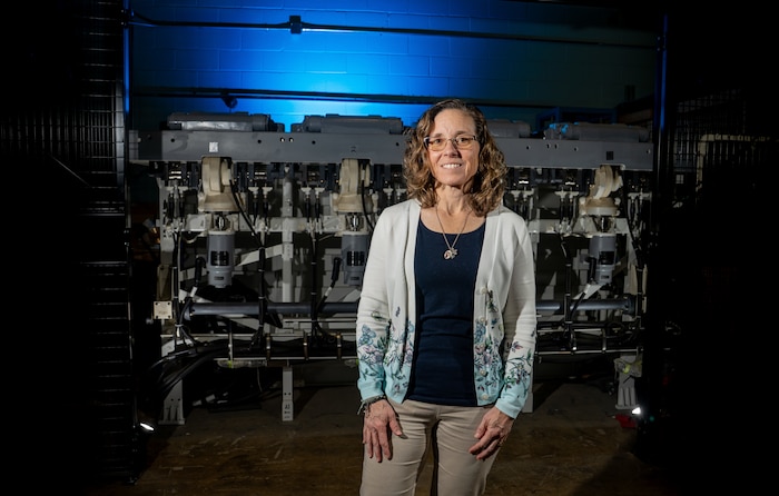 DAHLGREN, Va. — Karen Wingeart, division head for the Maritime Warfare Control Systems Division at Naval Surface Warfare Center Dahlgren Division, stands in a high bay facility used for combat systems testing. Wingeart leads efforts that support the development, integration and readiness of U.S. Navy warfighting capabilities.(Morgan Tabor/NSWCDD Photo)