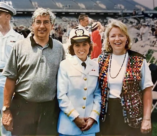 ANNAPOLIS, Md. — Karen Wingeart (center) stands with her parents at the U.S. Naval Academy following her graduation and commissioning as a U.S. Navy ensign on May 24, 1996.