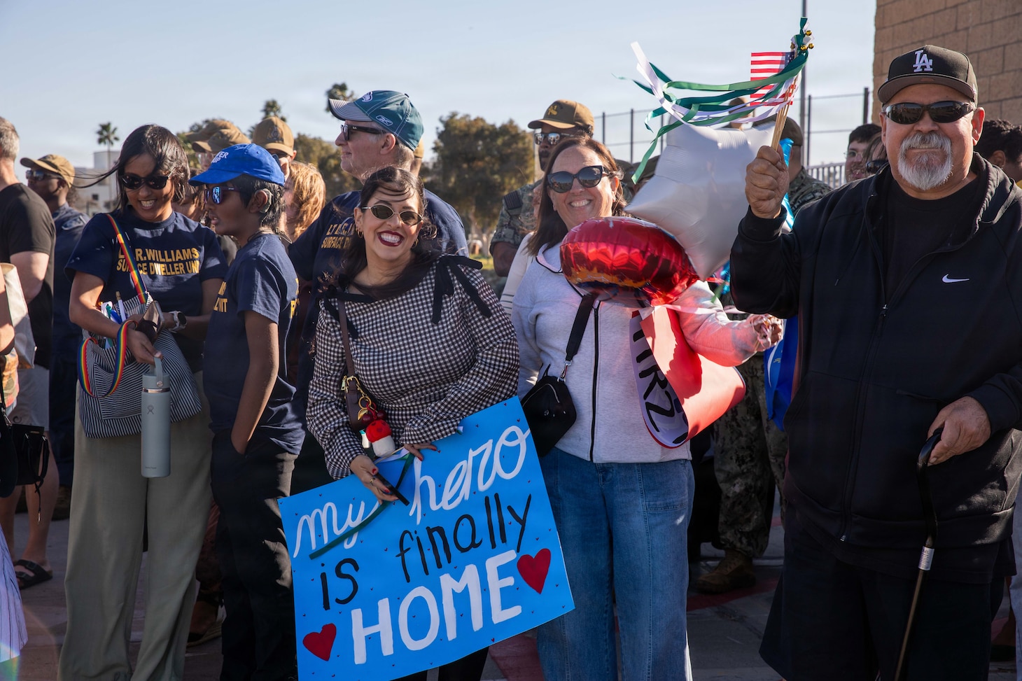 NAVAL BASE POINT LOMA - Families celebrate as Los Angeles-class fast-attack submarine USS Greeneville (SSN 772) returns to Naval Base Point Loma following a deployment to the U.S. Indo-Pacific Command area of responsibility, Jan. 30, 2026. Greeneville is assigned to Commander, Submarine Squadron 11, home to four Los Angeles-class fast-attack submarines, which are capable of supporting various missions, including anti-submarine warfare, anti-ship warfare, strike warfare and intelligence, surveillance and reconnaissance. (U.S. Navy photo by Mass Communication Specialist 2nd Class Rashan Jefferson)