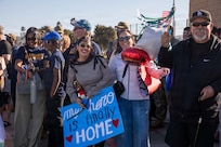 NAVAL BASE POINT LOMA - Families celebrate as Los Angeles-class fast-attack submarine USS Greeneville (SSN 772) returns to Naval Base Point Loma following a deployment to the U.S. Indo-Pacific Command area of responsibility, Jan. 30, 2026. Greeneville is assigned to Commander, Submarine Squadron 11, home to four Los Angeles-class fast-attack submarines, which are capable of supporting various missions, including anti-submarine warfare, anti-ship warfare, strike warfare and intelligence, surveillance and reconnaissance. (U.S. Navy photo by Mass Communication Specialist 2nd Class Rashan Jefferson)