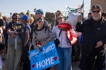 NAVAL BASE POINT LOMA - Families celebrate as Los Angeles-class fast-attack submarine USS Greeneville (SSN 772) returns to Naval Base Point Loma following a deployment to the U.S. Indo-Pacific Command area of responsibility, Jan. 30, 2026. Greeneville is assigned to Commander, Submarine Squadron 11, home to four Los Angeles-class fast-attack submarines, which are capable of supporting various missions, including anti-submarine warfare, anti-ship warfare, strike warfare and intelligence, surveillance and reconnaissance. (U.S. Navy photo by Mass Communication Specialist 2nd Class Rashan Jefferson)