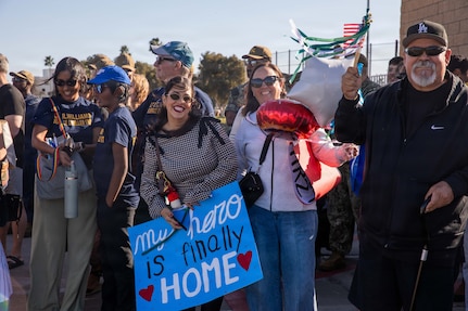 NAVAL BASE POINT LOMA - Families celebrate as Los Angeles-class fast-attack submarine USS Greeneville (SSN 772) returns to Naval Base Point Loma following a deployment to the U.S. Indo-Pacific Command area of responsibility, Jan. 30, 2026. Greeneville is assigned to Commander, Submarine Squadron 11, home to four Los Angeles-class fast-attack submarines, which are capable of supporting various missions, including anti-submarine warfare, anti-ship warfare, strike warfare and intelligence, surveillance and reconnaissance. (U.S. Navy photo by Mass Communication Specialist 2nd Class Rashan Jefferson)