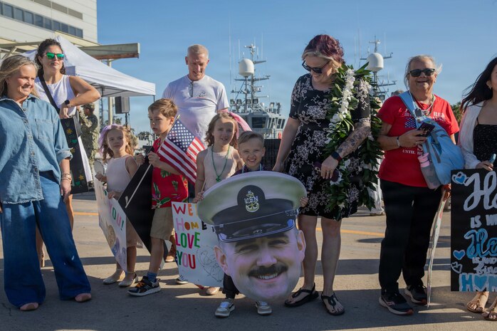 NAVAL BASE POINT LOMA, Calif. (Jan. 30, 2026) - Families celebrate as Los Angeles-class fast-attack submarine USS Greeneville (SSN 772) returns to Naval Base Point Loma following a deployment to the U.S. Indo-Pacific Command area of responsibility, Jan. 30, 2026. Greeneville is assigned to Commander, Submarine Squadron 11, home to four Los Angeles-class fast-attack submarines, which are capable of supporting various missions, including anti-submarine warfare, anti-ship warfare, strike warfare and intelligence, surveillance and reconnaissance. (U.S. Navy photo by Mass Communication Specialist 2nd Class Rashan Jefferson)