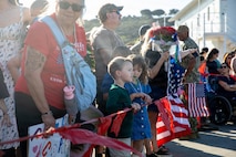 NAVAL BASE POINT LOMA, Calif. (Jan. 30, 2026) - Families celebrate as Los Angeles-class fast-attack submarine USS Greeneville (SSN 772) returns to Naval Base Point Loma following a deployment to the U.S. Indo-Pacific Command area of responsibility, Jan. 30, 2026. Greeneville is assigned to Commander, Submarine Squadron 11, home to four Los Angeles-class fast-attack submarines, which are capable of supporting various missions, including anti-submarine warfare, anti-ship warfare, strike warfare and intelligence, surveillance and reconnaissance. (U.S. Navy photo by Mass Communication Specialist 2nd Class Rashan Jefferson)