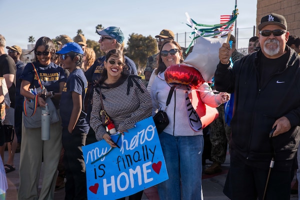 NAVAL BASE POINT LOMA - Families celebrate as Los Angeles-class fast-attack submarine USS Greeneville (SSN 772) returns to Naval Base Point Loma following a deployment to the U.S. Indo-Pacific Command area of responsibility, Jan. 30, 2026. Greeneville is assigned to Commander, Submarine Squadron 11, home to four Los Angeles-class fast-attack submarines, which are capable of supporting various missions, including anti-submarine warfare, anti-ship warfare, strike warfare and intelligence, surveillance and reconnaissance. (U.S. Navy photo by Mass Communication Specialist 2nd Class Rashan Jefferson)