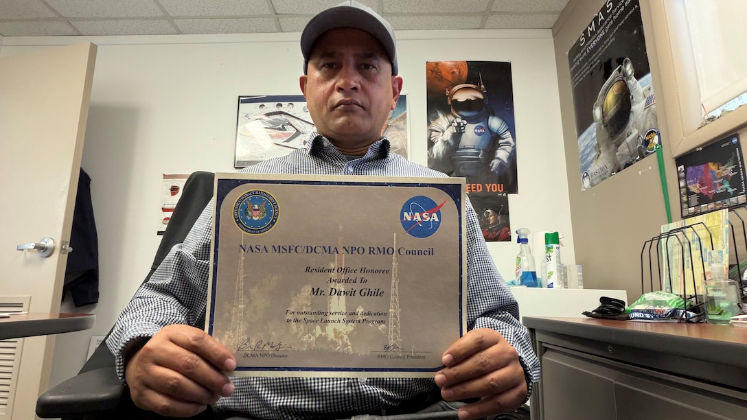A man holds a certificate