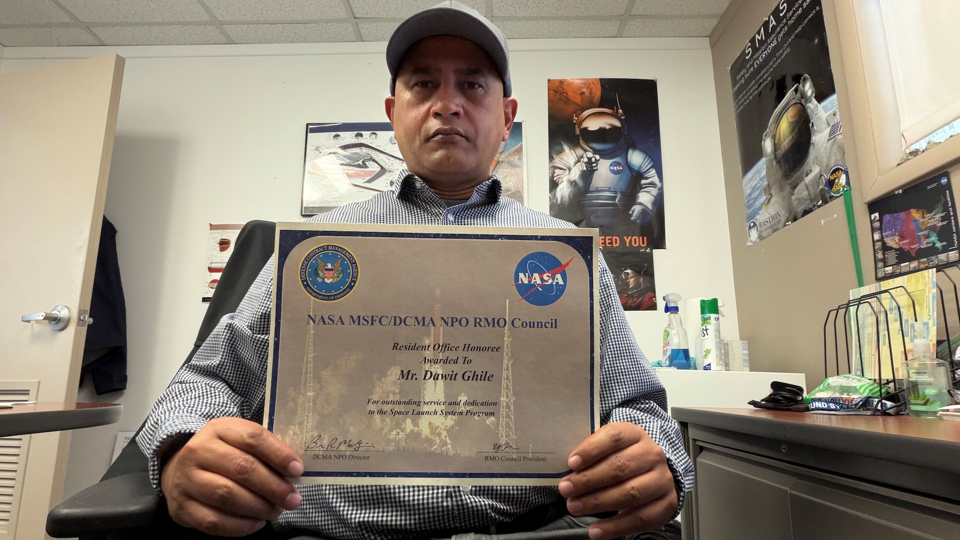 A man holds a certificate