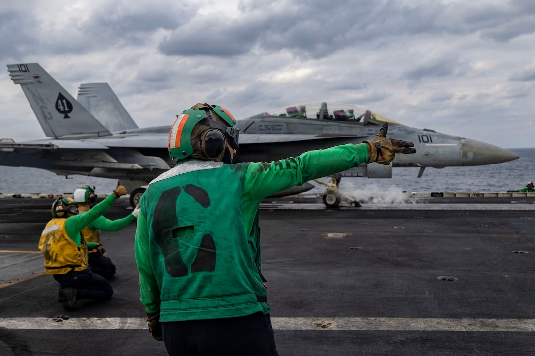 ARABIAN SEA (Jan. 28, 2026) An F/A-18F Super Hornet, attached to Strike Fighter Squadron (VFA) 41, prepares to launch from the flight deck of Nimitz-class aircraft carrier USS Abraham Lincoln (CVN 72) in the Arabian Sea, Jan. 28. Abraham Lincoln is deployed to the U.S. 5th Fleet area of operations to support maritime security and stability in the CENTCOM area of responsibility. (U.S. Navy photo by Mass Communication Specialist Seaman Zoe Simpson)