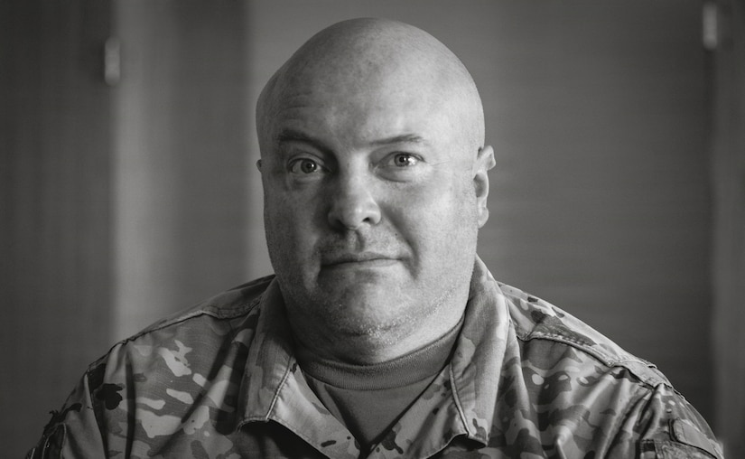 U.S. Army Sgt. Glenn Brennan, a public affairs specialist with the 109th Mobile Public Affairs Detachment, 213th Regional Support Group, Pennsylvania National Guard, poses for a photo at the 109th MPAD's mobilization station at Fort Hood, Texas, Dec. 28, 2025. (U.S. Army National Guard photo illustration by Maj. Travis Mueller)