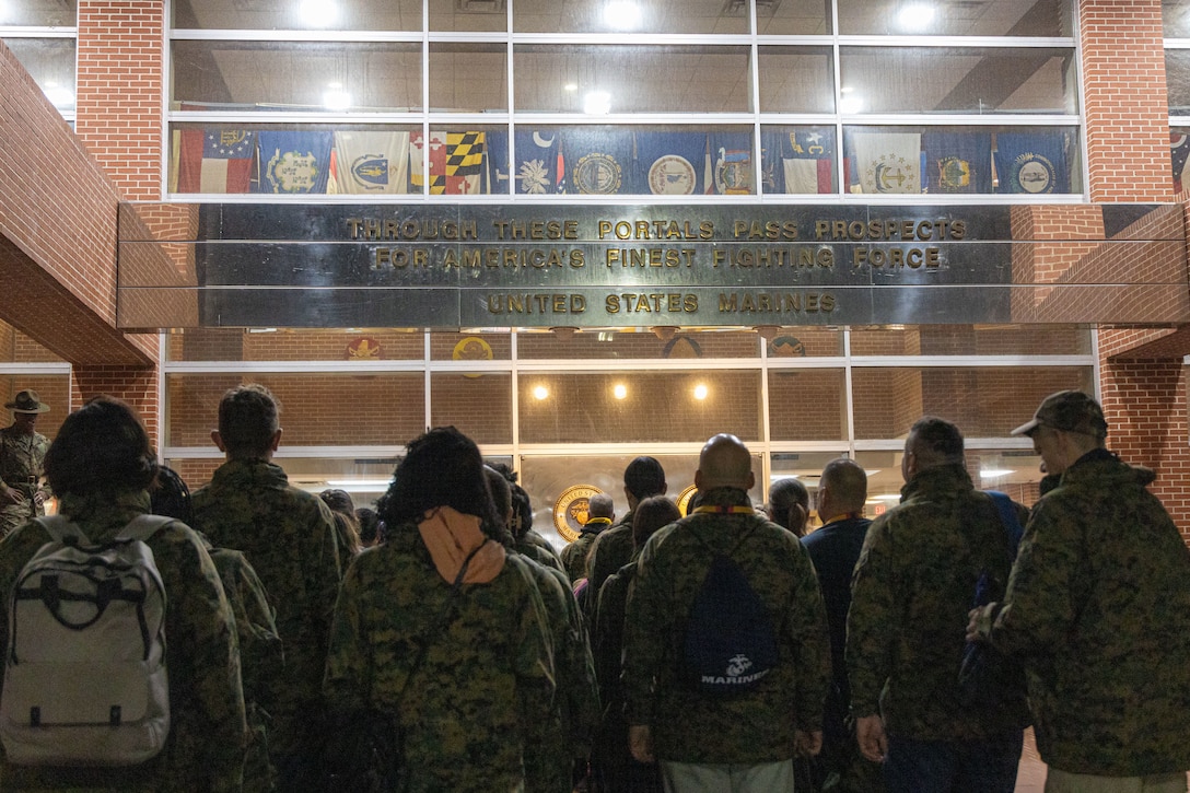 Educators with Recruiting Stations Harrisburg and Springfield stand in formation, during an Educators Workshop (EWS) on Marine Corps Recruit Depot Parris Island, South Carolina, Feb. 12, 2025. EWS is designed to demystify recruit training, foster stronger relationships among recruiting personnel and the communities they serve, and increase advocacy among influencers who help shape decisions of young men and women. (U.S. Marine Corps photo by Sgt. Hernan Rodriguez)