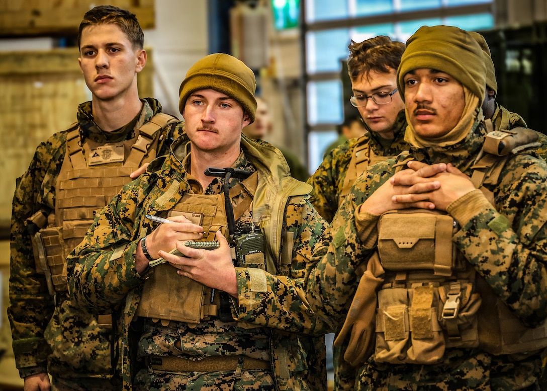 U.S. Marine Corps Lance Cpl. Jesse Robinson, a motor vehicle operator with 2nd Distribution Support Battalion, records key information during a convoy operations brief at a Marine Corps Prepositioning Program–Norway cave site Jan. 21, 2026, in Norway, in preparation for convoy operations supporting exercise Cold Response 26. (U.S. Marine Corps photo by Cpl. Nicholas Martinez)