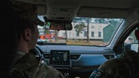 U.S. Army Pfc. Jack Hajewski, a military police Soldier with the 327th Military Police Battalion, 102nd Military Police Company, waits for a cargo vehicle to enter the camp to conduct a Random Antiterrorism Measure at Camp Adazi, Latvia, on Dec. 10, 2025. RAMs provide a visible security presence and help safeguard personnel, equipment, and facilities, supporting force protection efforts and contributing to overall readiness among U.S. and NATO allies. (U.S. Army photo by Sgt. James Garcia)