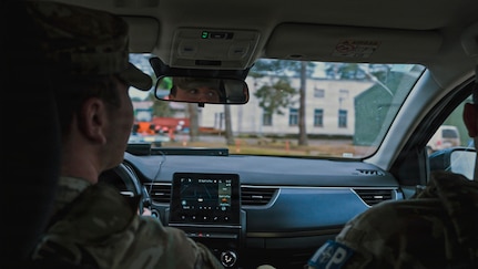 U.S. Army Pfc. Jack Hajewski, a military police Soldier with the 327th Military Police Battalion, 102nd Military Police Company, waits for a cargo vehicle to enter the camp to conduct a Random Antiterrorism Measure at Camp Adazi, Latvia, on Dec. 10, 2025. RAMs provide a visible security presence and help safeguard personnel, equipment, and facilities, supporting force protection efforts and contributing to overall readiness among U.S. and NATO allies. (U.S. Army photo by Sgt. James Garcia)
