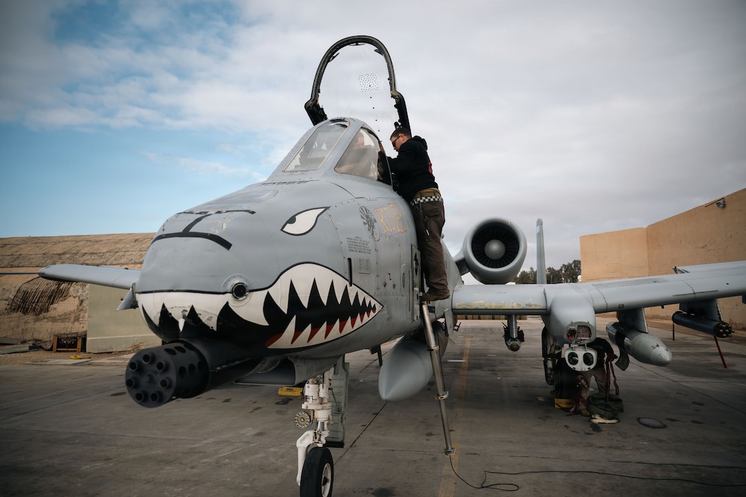 U.S. Air Force Airman 1st Class Connor Smith, 75th Expeditionary Fighter Generation Squadron crew chief, and Capt. James “Vita” Garrity, 75th Expeditionary Fighter Squadron pilot, conduct preflight inspections on an A-10 Thunder II aircraft at a base in the U.S. Central Command area of responsibility, Jan. 29, 2026. (U.S. Air Force photo by Senior Airman Jonah Bliss)