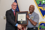 260121-N-DG679-1005

JACKSONVILLE, Fla. – Fleet Readiness Center Southeast’s (FRCSE) Executive Director, Darrell White, presents Anthony Harris, an aircraft overhaul and repair supervisor on FRCSE’s T-6 Texan II production line, with the Naval Air Systems Command’s Supervisor of the Year Award for FRCSE.