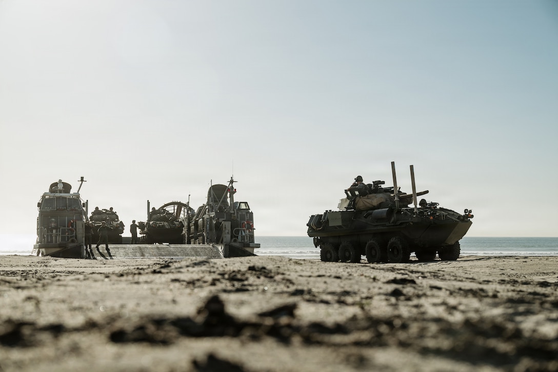 A U.S. Marine Corps LAV-25 with Battalion Landing Team 3/5, 11th Marine Expeditionary Unit, disembarks a landing craft, air cushion with Assault Craft Unit 5 on Marine Corps Base Camp Pendleton, California, Jan. 30, 2026. The 11th MEU is currently underway aboard the Boxer Amphibious Ready Group in the U.S. 3rd Fleet area of operations conducting integrated training that enhances lethality and warfighting readiness. (U.S. Marine Corps photo by Lance Cpl. Luke Rodriguez)