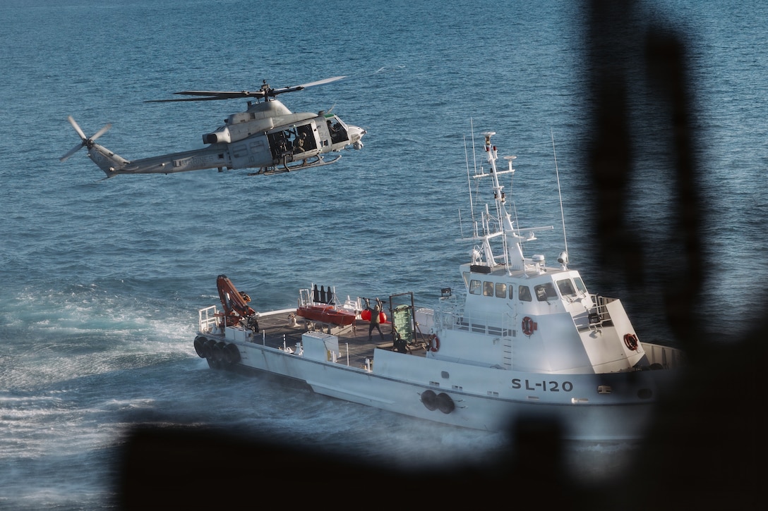 A U.S. Marine Corps UH-1Y Venom attached to Marine Medium Tiltrotor Squadron (VMM) 163 (Reinforced), 11th MEU, practices hovering over a target vessel before conducting a visit, board, search and seizure exercise in the Pacific Ocean, Feb. 2, 2026. The 11th MEU is currently underway aboard the Boxer Amphibious Ready Group in the U.S. 3rd Fleet area of operations conducting integrated training that enhances lethality and warfighting readiness. (U.S. Marine Corps photo by Sgt. Joseph Helms)