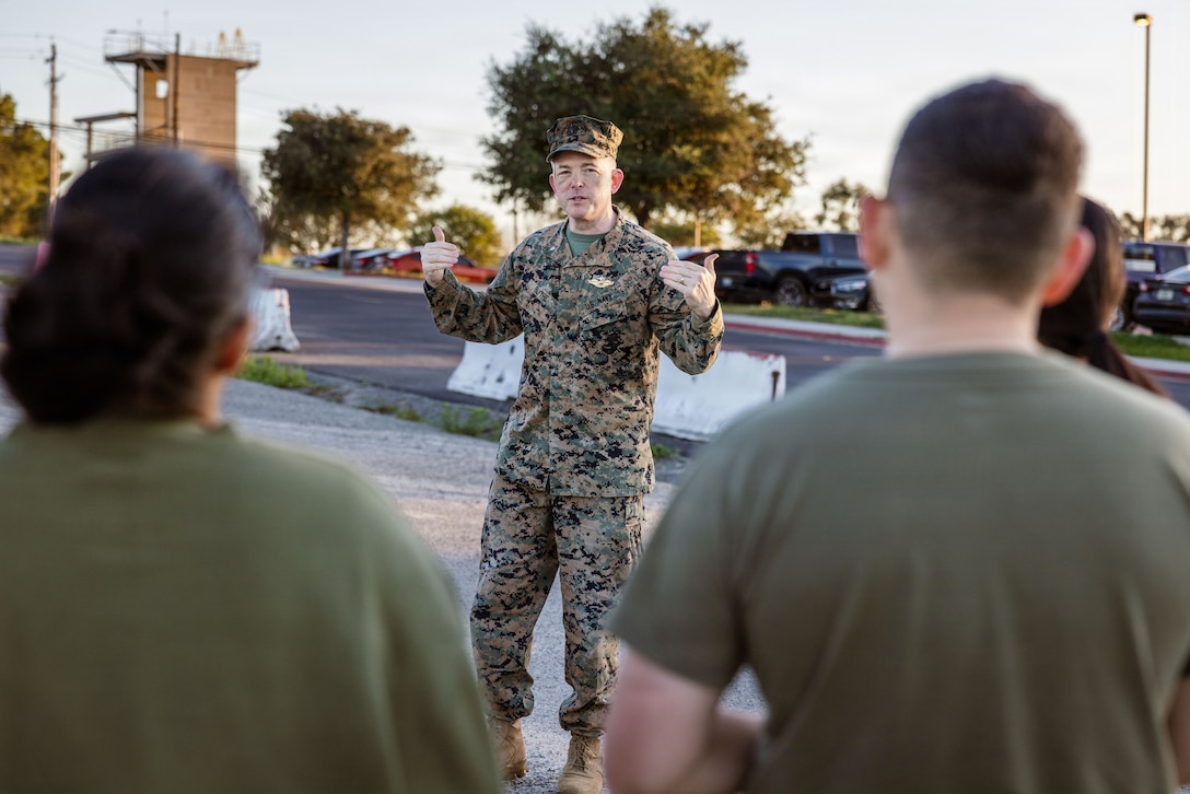 U.S. Navy Cmdr. Jeremy Blythe, a chaplain assigned to I Marine Expeditionary Force Information Group, delivers a motivational speech to I MIG Marines prior to a spiritual fitness run at Marine Corps Base Camp Pendleton, California, Jan. 30, 2026.