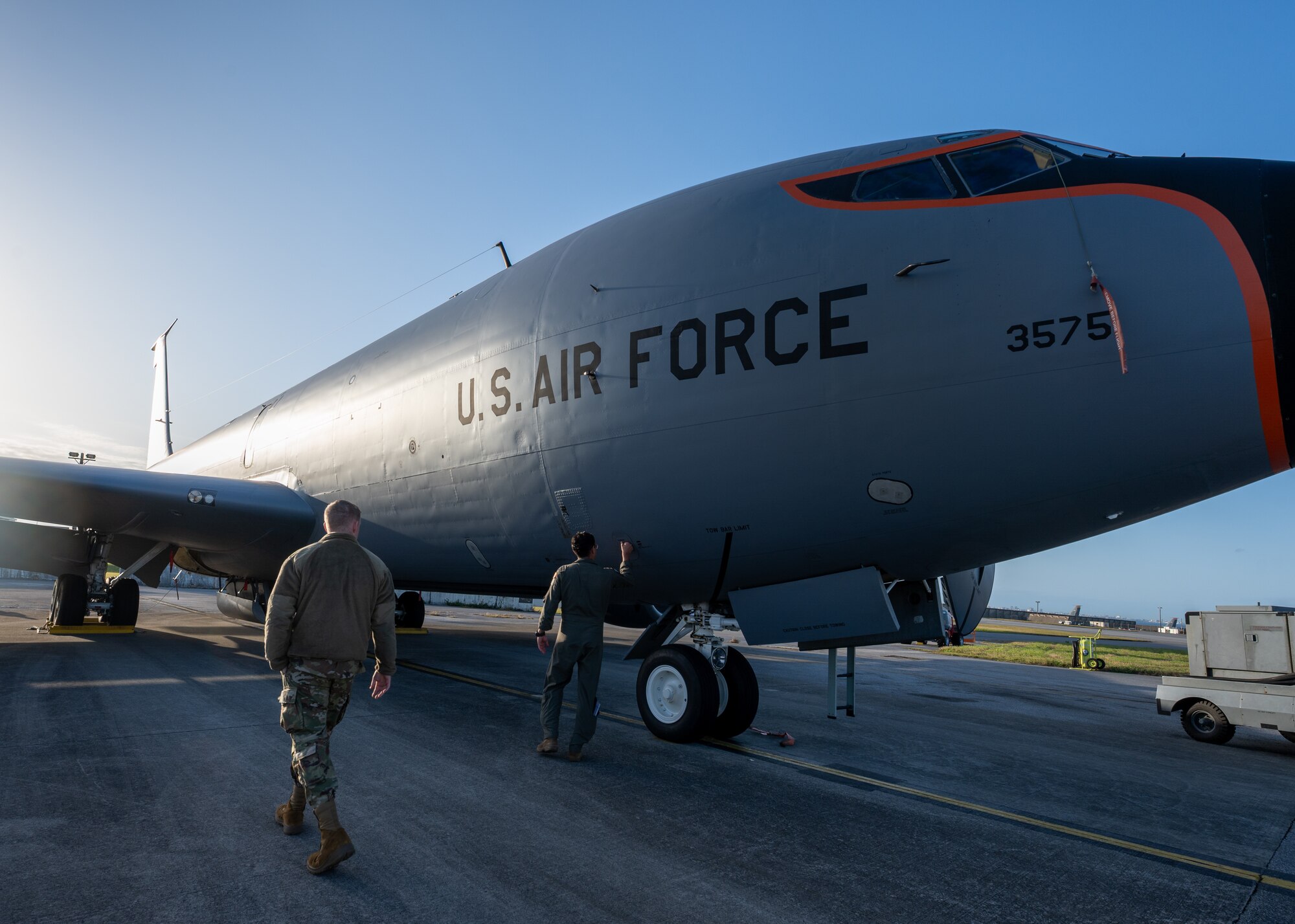 U.S. Air Force Airmen assigned to the 909th Air Refueling Squadron and 909th Aircraft Maintenance Unit conduct preflight checks on a KC-135 Stratotanker at Kadena Air Base, Japan.