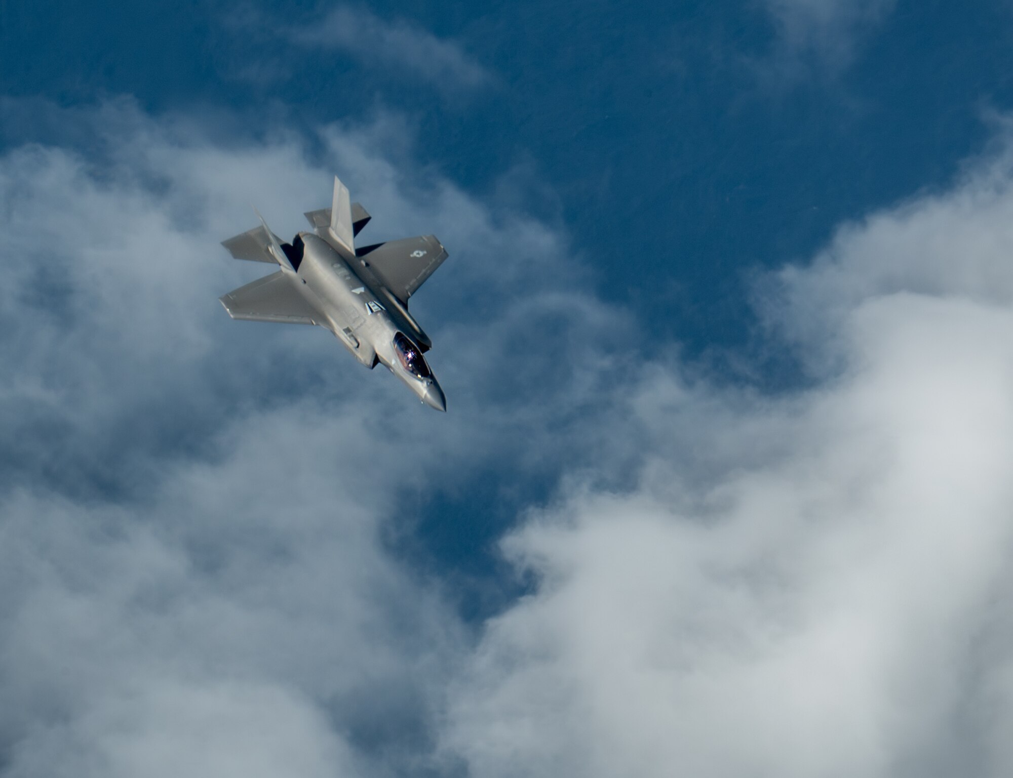 A U.S. Air Force F-35A Lightning II assigned to the 4th Expeditionary Fighter Squadron, deployed to Kadena Air Base, flies over the Pacific Ocean.