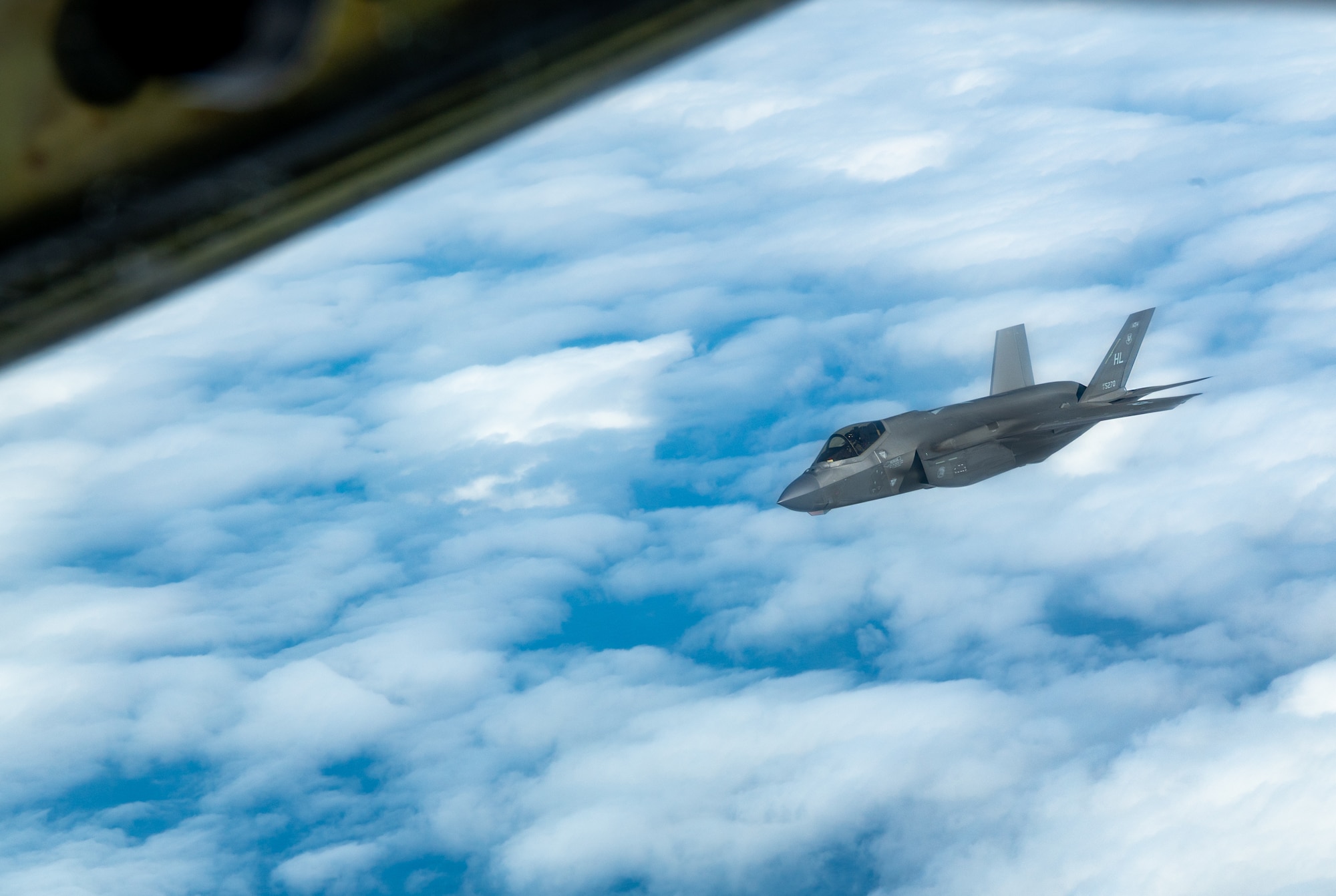 A U.S. Air Force F-35A Lightning II assigned to the 4th Expeditionary Fighter Squadron, deployed to Kadena Air Base, flies over the Pacific Ocean.