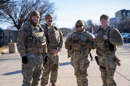 Ohio National Guard Soldiers supporting the D.C. Safe and Beautiful mission stand watch in their assigned patrol area in Washington, D.C., January 2026. Through presence patrols across key transit hubs and surrounding neighborhoods, the Soldiers work alongside local and federal law enforcement partners to help deter crime and enhance public safety. Their visible presence reinforces community confidence and supports a coordinated, whole-of-government approach to keeping the nation’s capital safe and accessible. (U.S. Air National Guard photo by Master Sgt. William Blankenship)