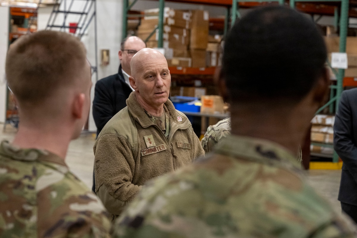 U.S. Air Force Maj. Gen. Donald Carpenter, F-35 fleet readiness and sustainment director, left, speaks with Airmen assigned to the 35th Logistics Readiness Squadron materiel management flight at Misawa Air Base, Japan, Jan. 28, 2026.