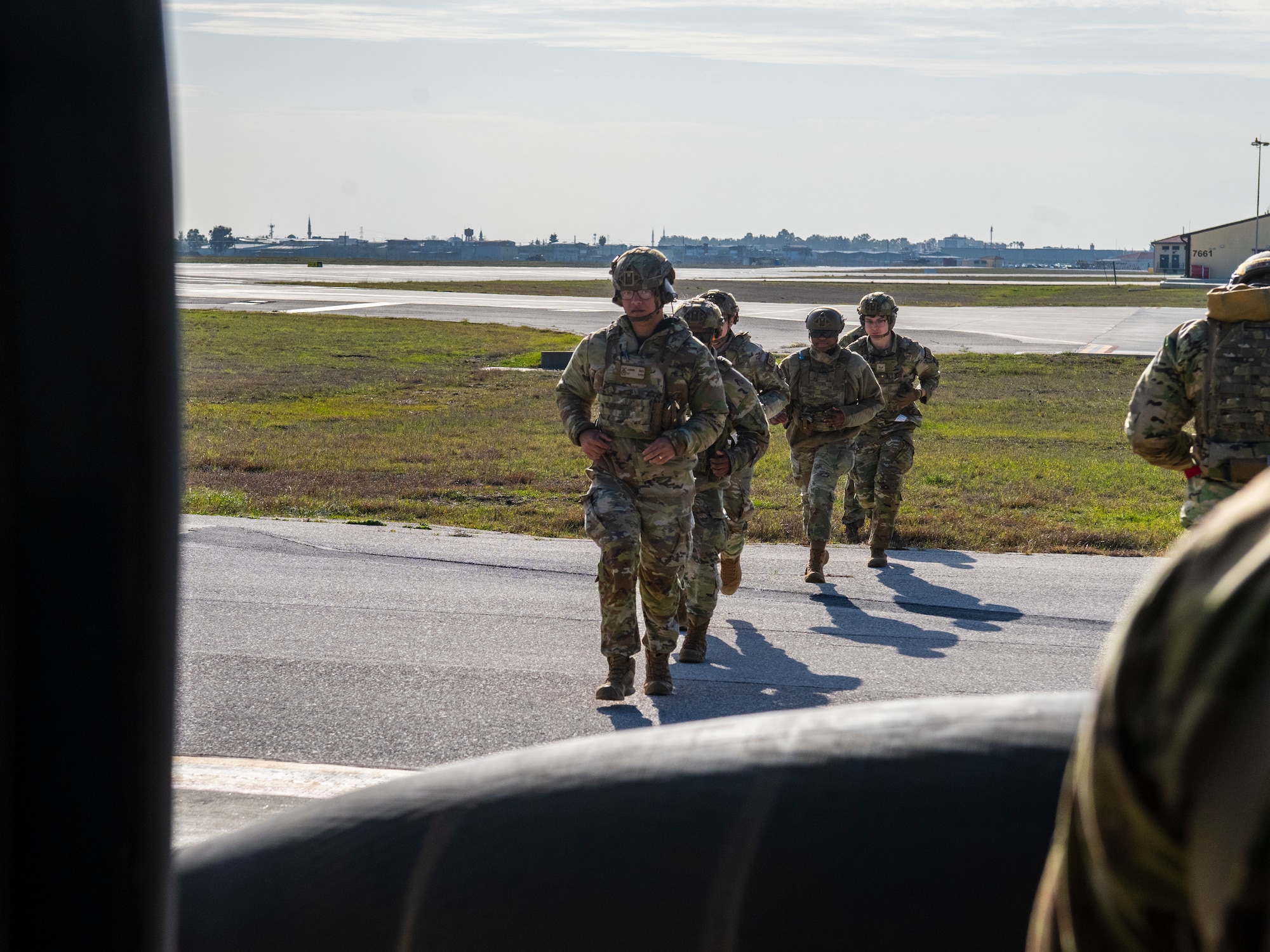 U.S. AAirmen approach a UH-60 Black Hawk helicopter