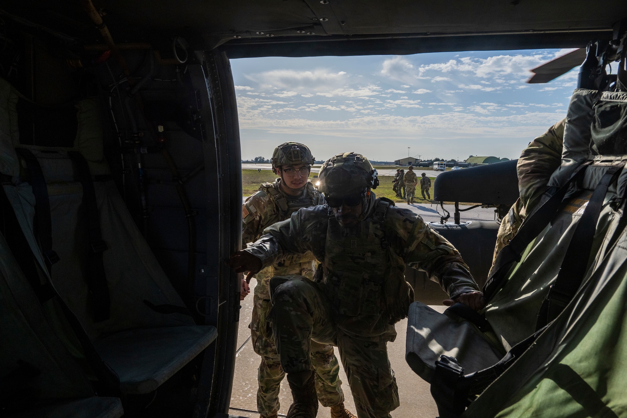 U.S. Airmen board a UH-60 Black Hawk helicopter