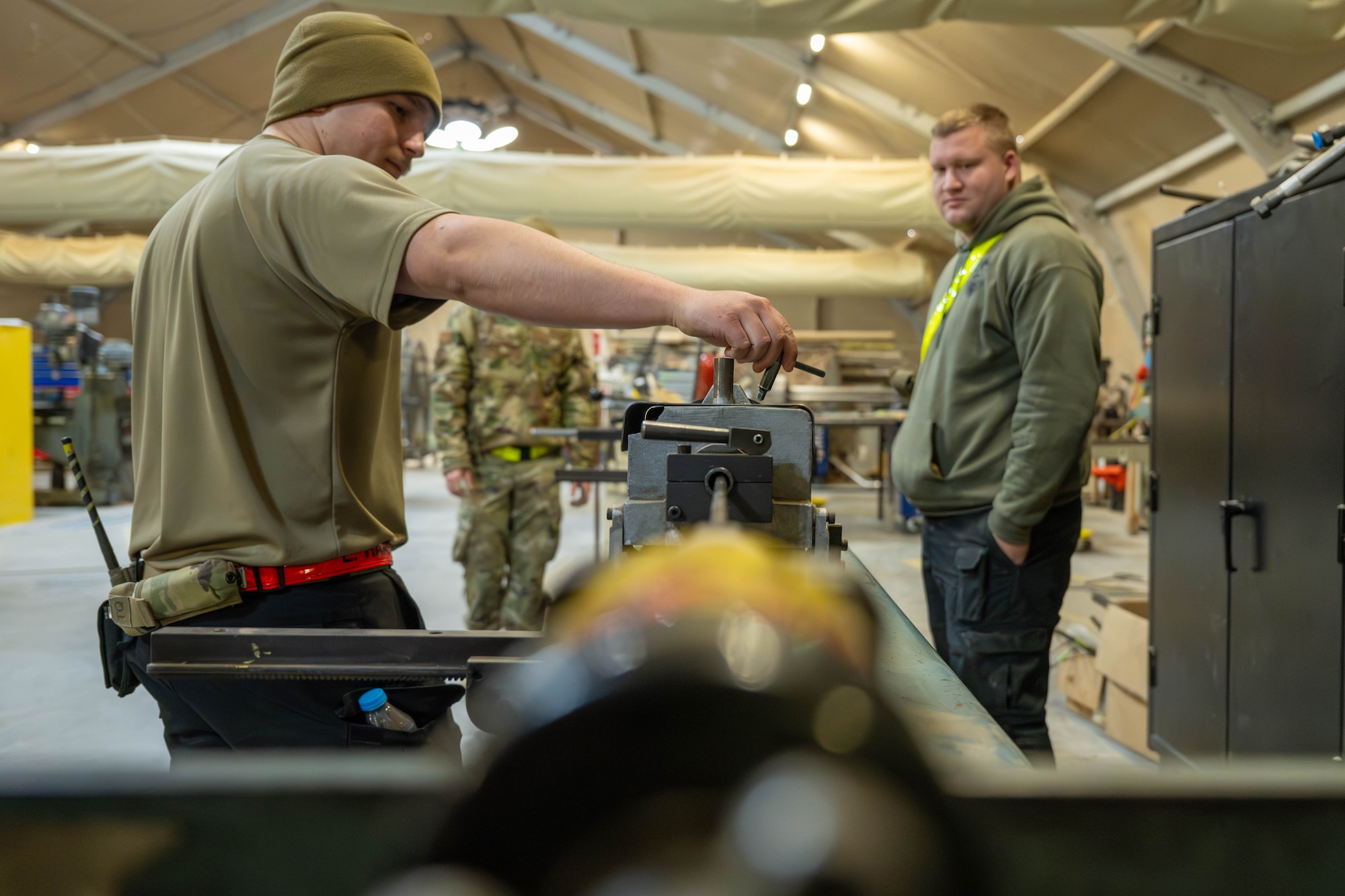 U.S. Air Force Airmen use a manual tube-bending machine in the U.S. Central Command area of responsibility, Jan. 28, 2026. Producing a single tube with the manual tool requires up to a total of 21 man-hours. (U.S. Air Force photo by Senior Airman Kari Degraffenreed)