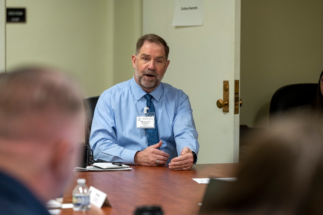 DLA Disposition Services Director Mike Cannon talks with staff