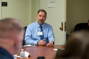 DLA Disposition Services Director Mike Cannon talks with staff