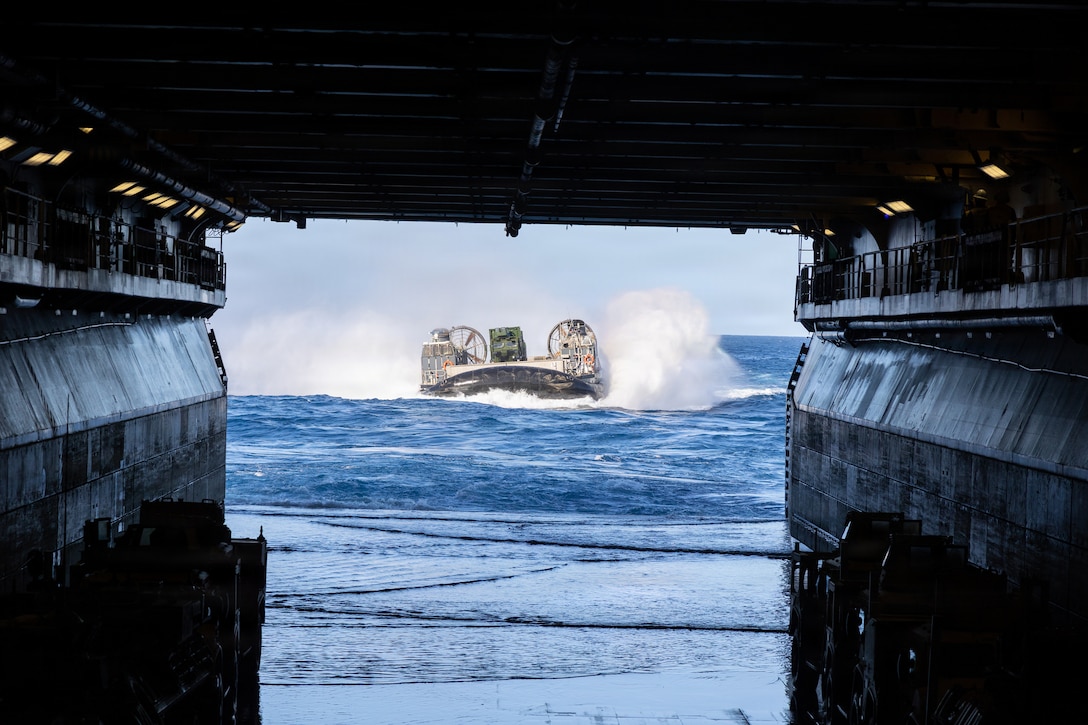 A U.S. Navy landing craft, air cushion approaches Wasp-class amphibious assault USS Iwo Jima (LHD 7), during LCAC operations while underway in the Caribbean Sea, Jan. 21, 2026. U.S. military forces are deployed to the Caribbean in support of the U.S. Southern Command mission, Department of War-directed operations, and the president’s priorities to disrupt illicit drug trafficking and protect the homeland. (U.S. Marine Corps photo)