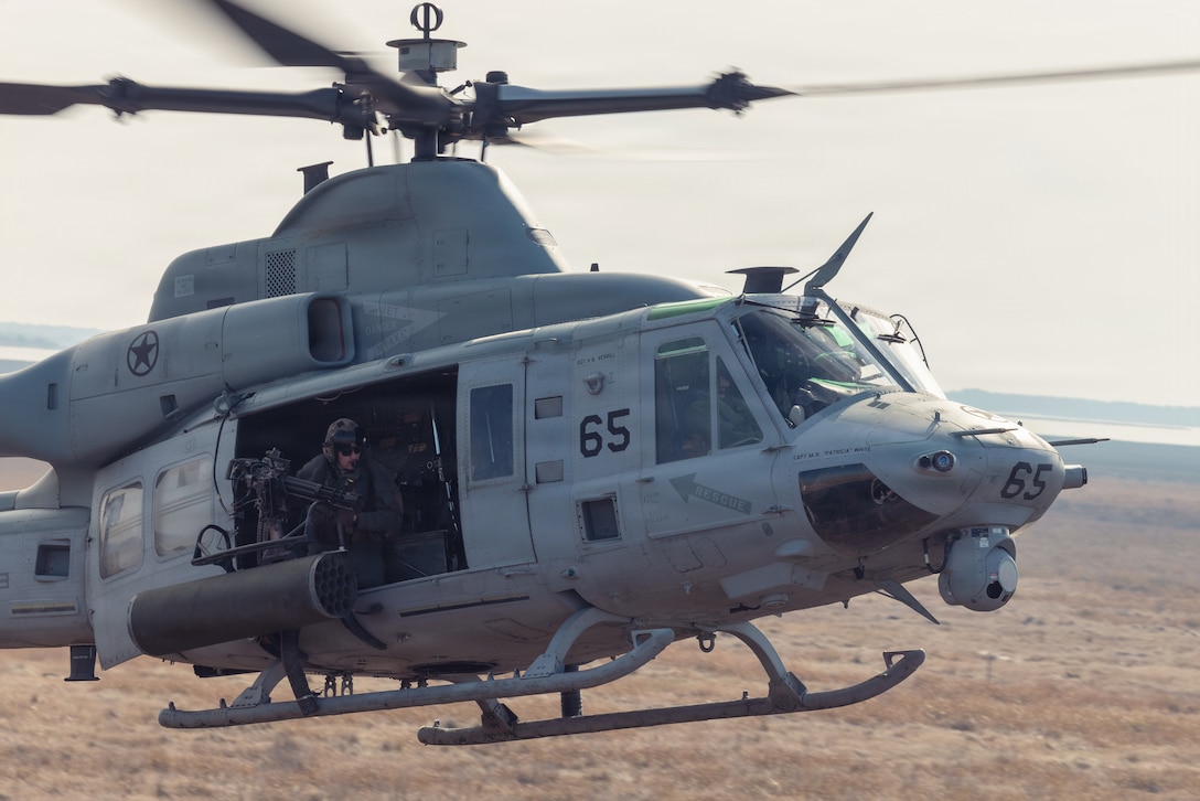 A U.S. Marine Corps UH-1Y Venom helicopter assigned to Marine Light Attack Helicopter Squadron 269 (HMLA-269), Marine Aircraft Group 29, 2nd Marine Aircraft Wing, prepares to land during Exercise America Strike at Bombing Target 11, Piney Island, North Carolina, Jan. 22, 2026. The training enabled joint terminal attack controllers and joint fires observers to build and validate close-air support proficiency and certify personnel for operational readiness. Bombing Target 11, an outlying field operated by Marine Corps Air Station Cherry Point, provides the infrastructure and realistic training environment necessary for units to safely and effectively employ air-delivered munitions. (U.S. Marine Corps photo by Cpl. Andre Marshall)