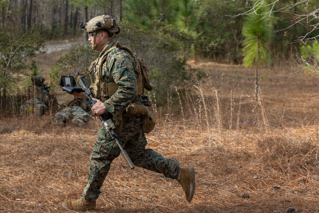U.S. Marine Corps Lance Cpl. Steven Salcedo Jr., an infantry rifleman and a small unmanned aircraft system operator with 1st Battalion, 2nd Marine Regiment, 2nd Marine Division, participates in a simulated squad attack on Marine Corps Base Camp Lejeune, North Carolina, Jan. 22, 2026. The live fire drone attack exercise was held to demonstrate the integration of the NEROS Archer, a newly introduced first-person view drone employed by the Department of War, with infantry Marines. (U.S. Marine Corps photo by Lance Cpl. Isabelle Hutmacher)