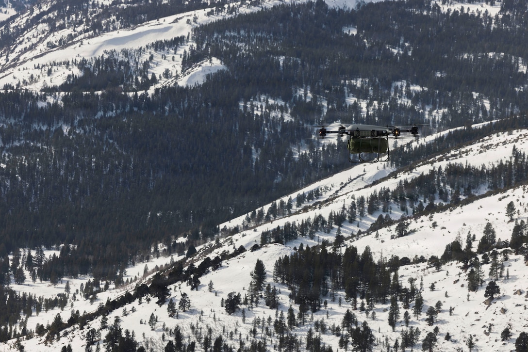A Tactical Resupply Vehicle 150 carries a 65-pound load during small, unmanned aircraft system operations as part of Mountain Training Exercise 1-26 at Marine Corps Mountain Warfare Training Center in Bridgeport, California, Jan. 31, 2026. Exercises like MTX 1-26 prove Marines’ ability to provide flexible and responsive combat service support during high intensity combat operations in contested and mountainous terrain. (U.S. Marine Corps photo by Lance Cpl. Isabella Ramos)