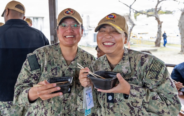 YOKOSUKA, Japan (Jan. 28, 2026) — Cmdr. Katherine Gelenter and Cmdr. Sachiko Ikari, assigned to U.S. Naval Hospital Yokosuka, enjoy hot soup during a mochitsuki (mochi-pounding) cultural exchange event at the hospital. The Japanese Fellows organized the event to highlight cultural partnership and collaboration between U.S. and Japanese medical professionals. The Japanese Fellowship Program is a yearlong graduate medical education program that has trained Japanese physicians at USNH Yokosuka since 1952. (U.S. Navy photo by Daniel Taylor/USNMRTC Yokosuka Public Affairs)