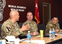 Col. Deon Maxwell, left, commander of U.S. Army Medical Logistics Command, briefs leadership from U.S. Army Communications-Electronics Command at Fort Detrick, Md. During the Jan. 29 workforce optimization brief, AMLC leaders provided Maj. Gen. James D. Turinetti IV, center, commanding general of CECOM, and CECOM Command Sgt. Maj. Jay High with a deep dive into key transformation initiatives.
