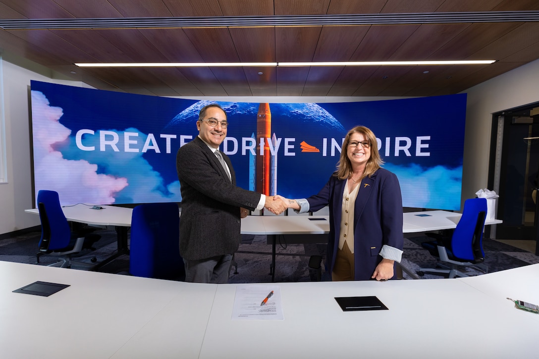 Mr. Benito Perez, research engineer at ERDC’s Construction Engineering Research Lab (CERL) and Dr. Shery Welsh, executive director of the University of Texas at El Paso Aerospace Center, celebrate the signed Educational Partnership Agreement.