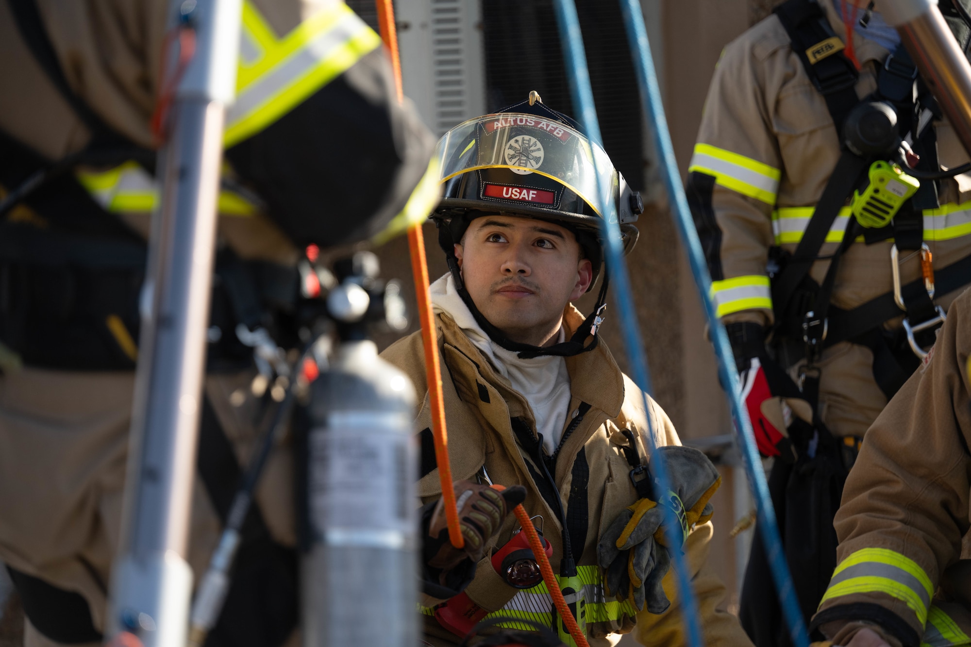 U.S. Air Force Senior Airman Brandon Sigala, 97th Civil Engineer Squadron Fire Department driver operator, prepares to conduct a rescue at Altus Air Force Base (AFB), Oklahoma, Jan. 20, 2026. Members of the Fire Department were evaluated on their ability to use a rig while simulating a confined space rescue. (U.S. Air Force photo by Airman 1st Class Emma Wright)